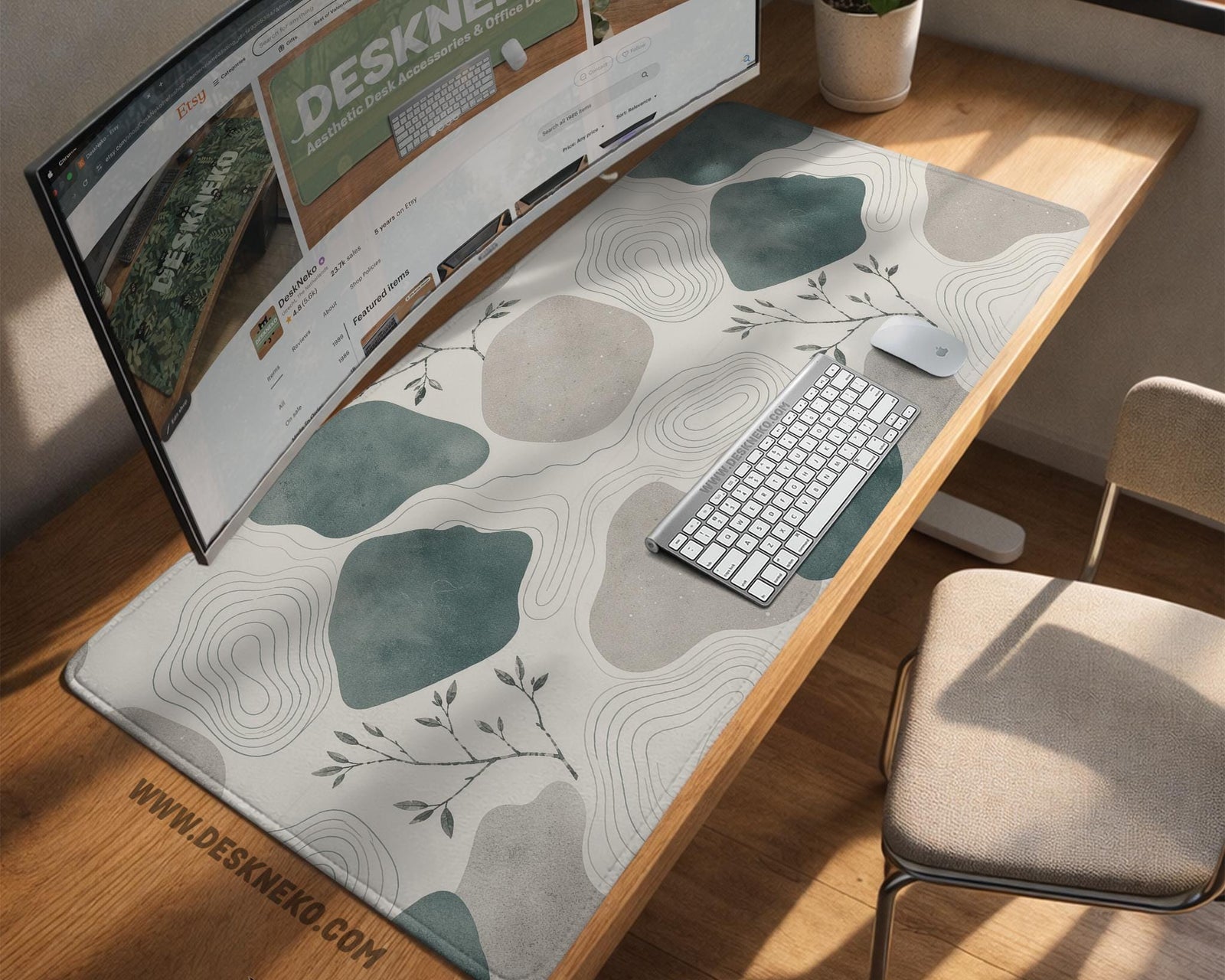 A desk mat with sage green abstract blocks, cream space, gray stone-like shapes, fine topographic contour lines, and small branch details.