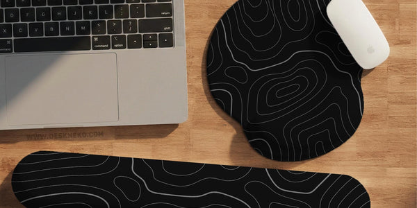 Black mousepad with a gray topographic contour line pattern shown with matching keyboard wrist rest options.
