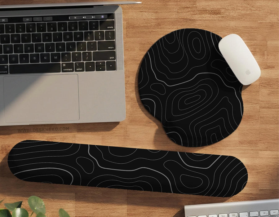 Black mousepad with a gray topographic contour line pattern shown with matching keyboard wrist rest options.