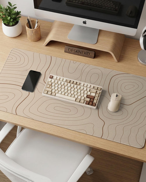 Beige desk mat with soft brown topographic contour lines on a neutral background.