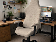 Beige chair cover with a minimalist topographic line pattern shown on a high back chair with armrests.