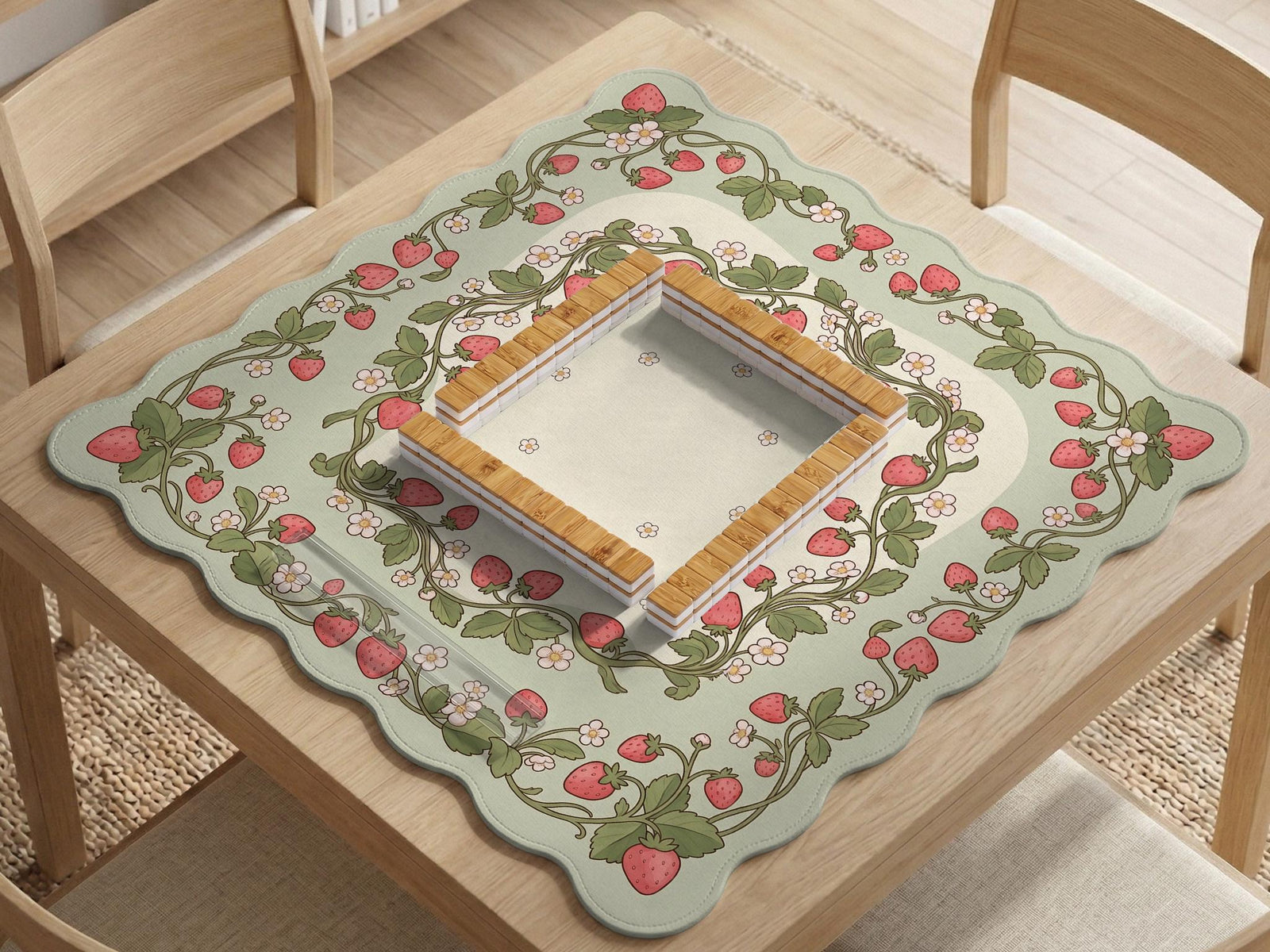 Square mahjong mat with a strawberry floral pattern, sage green background, pink berries, and leafy vines, with a blank center area.