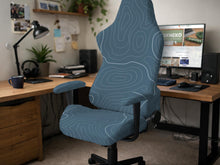 Slate gray chair cover with a blue gray topographic line pattern shown on a high back gaming chair.