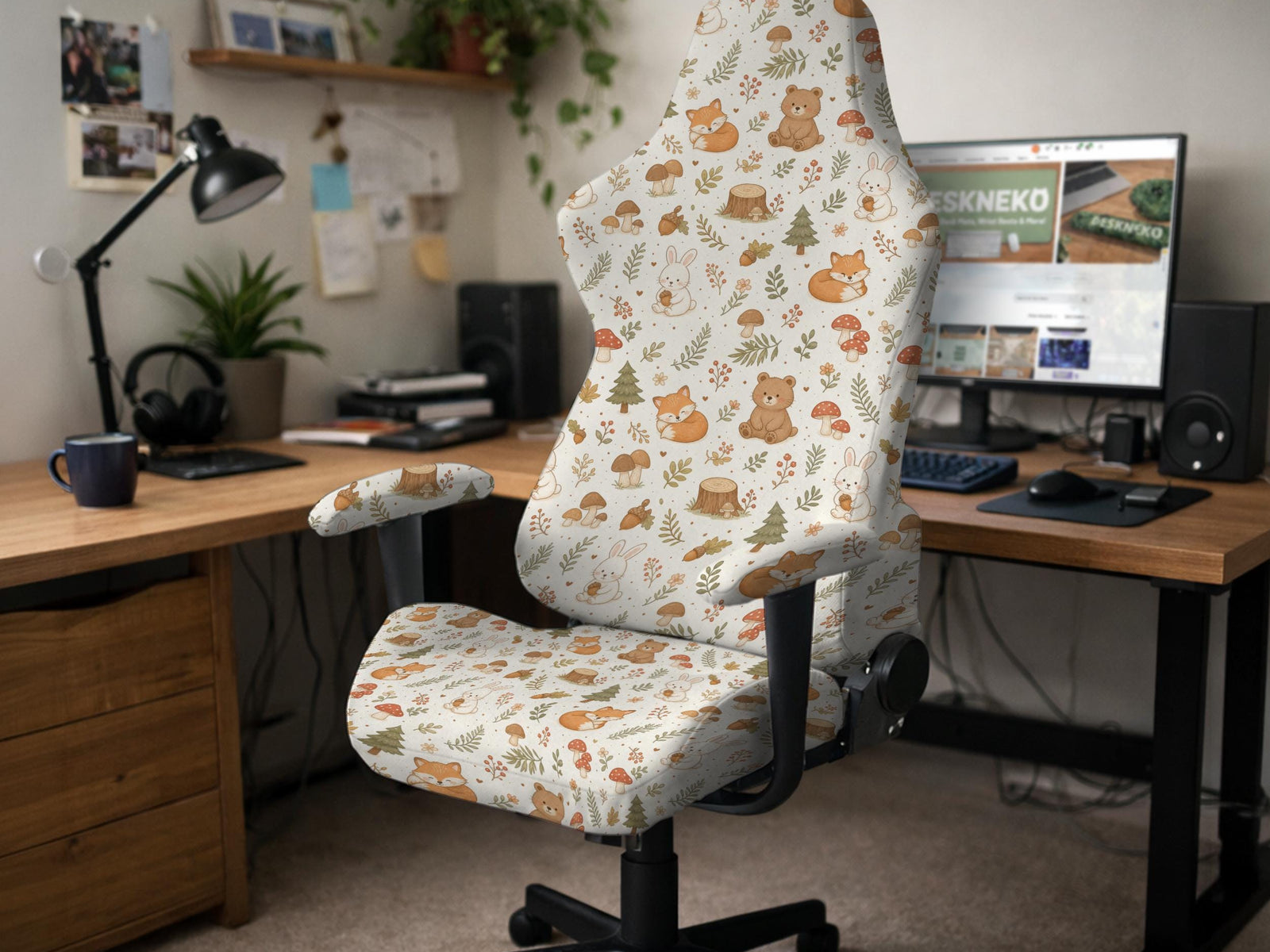 A gaming chair cover with a woodland animal print featuring foxes, rabbits, bears, mushrooms, and leaves in green, brown, and beige tones.