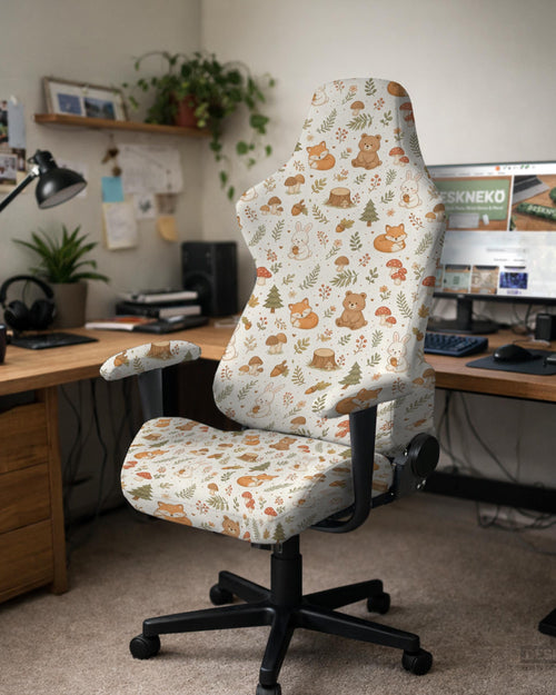A gaming chair cover with a woodland animal print featuring foxes, rabbits, bears, mushrooms, and leaves in green, brown, and beige tones.