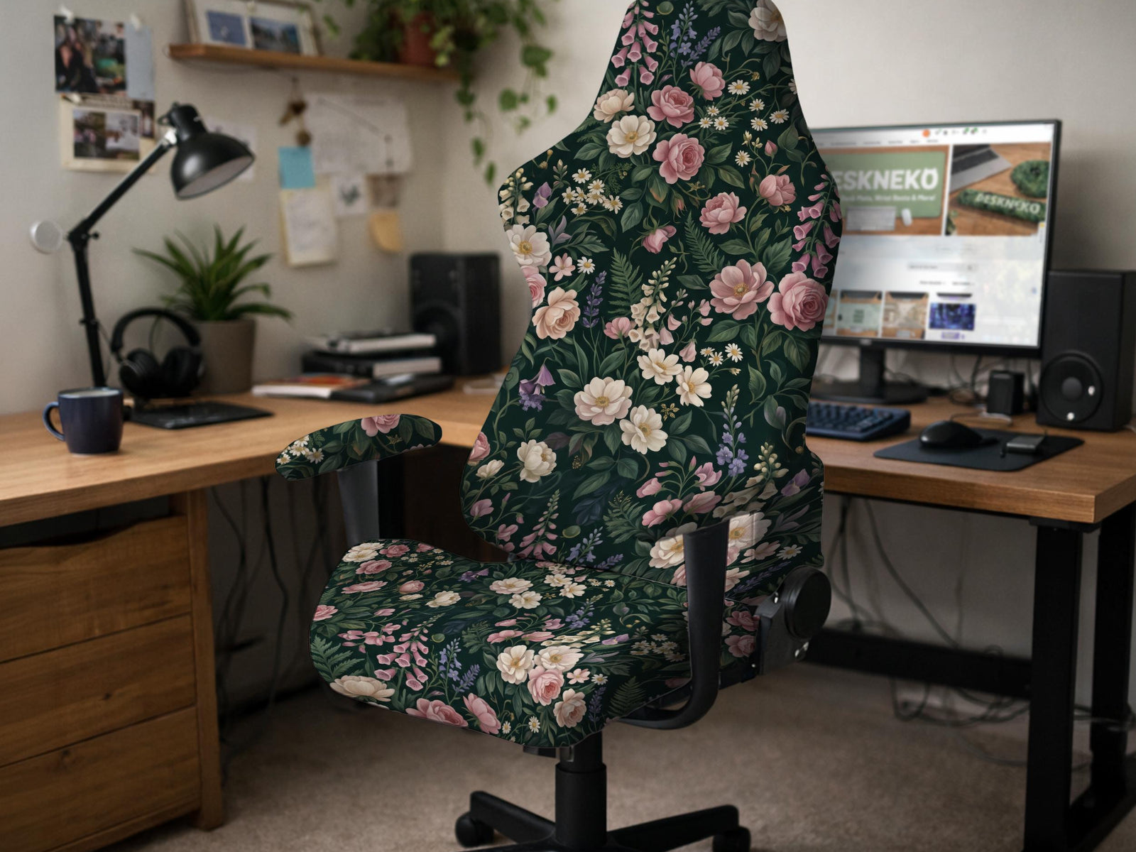 Dark botanical floral print chair cover shown on a black high back gaming chair with armrests.