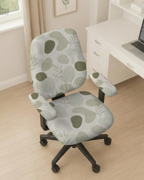 Green desk chair cover with an abstract leaf pattern in soft neutral tones.