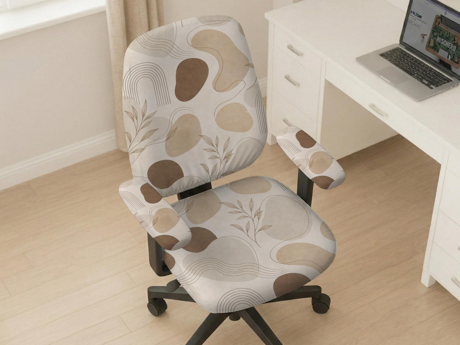 Beige chair cover with abstract organic shapes, small botanical details, and thin linework on a light neutral background.