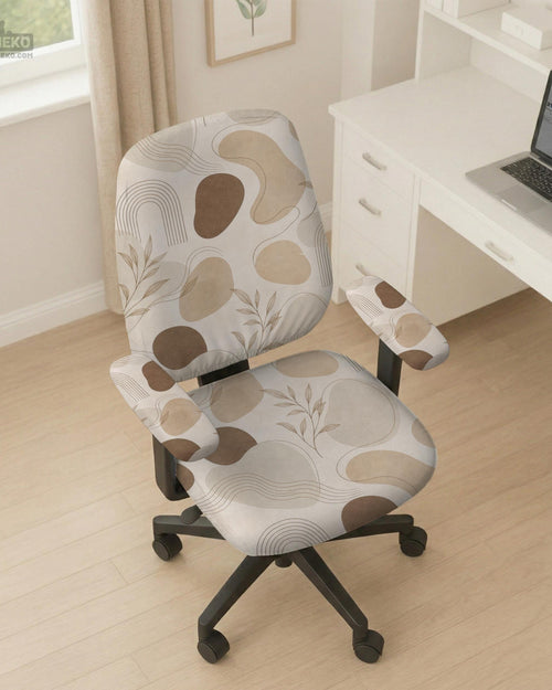 Beige chair cover with abstract organic shapes, small botanical details, and thin linework on a light neutral background.