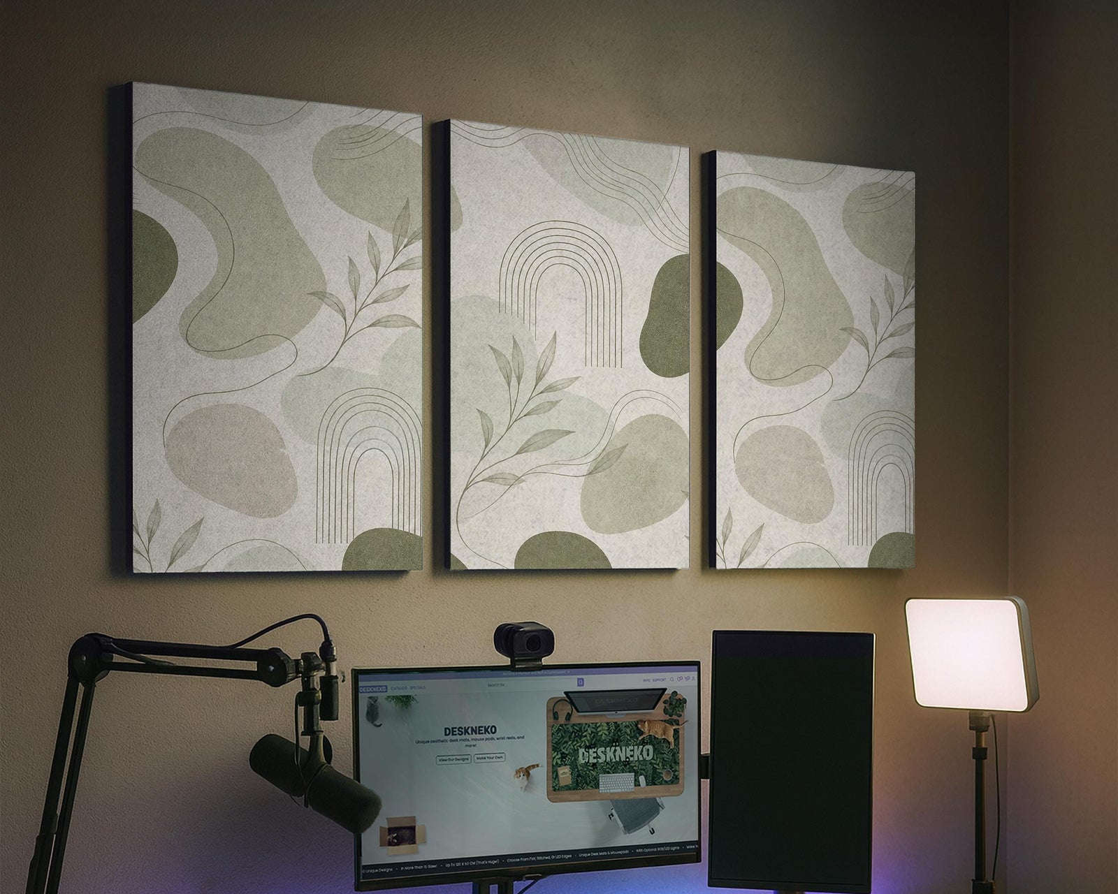 Three sage acoustic wall panels with an abstract design, curved linework, and small botanical details arranged in a triptych layout.