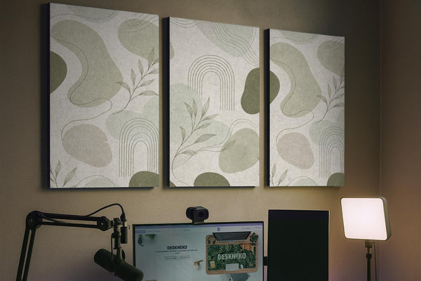 Three sage acoustic wall panels with an abstract design, curved linework, and small botanical details arranged in a triptych layout.