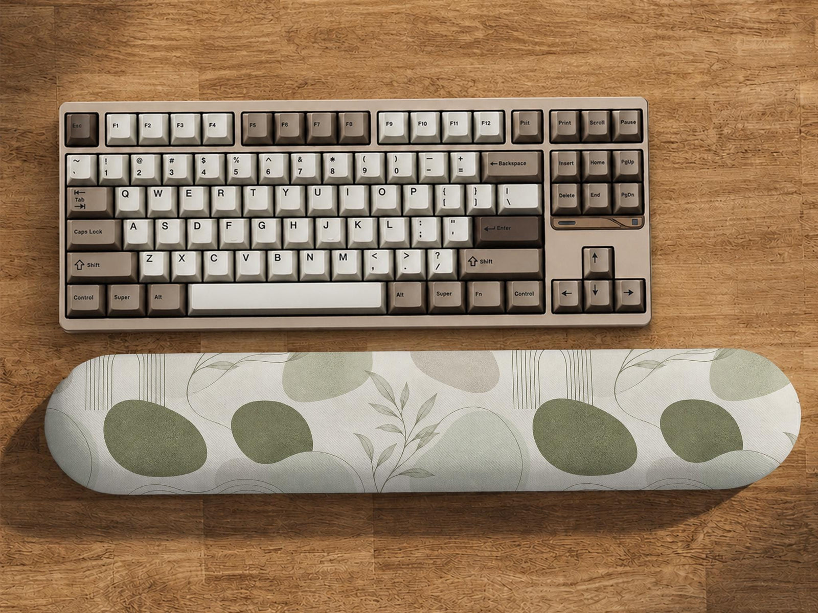 Sage green desk mat and wrist rest design with abstract botanical shapes and fine line details on a light background.
