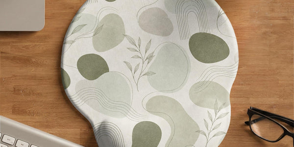 Green abstract botanical mouse pad with a rounded organic pattern and matching keyboard wrist rest option.