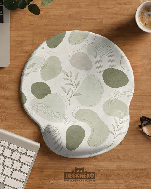 Green abstract botanical mouse pad with a rounded organic pattern and matching keyboard wrist rest option.