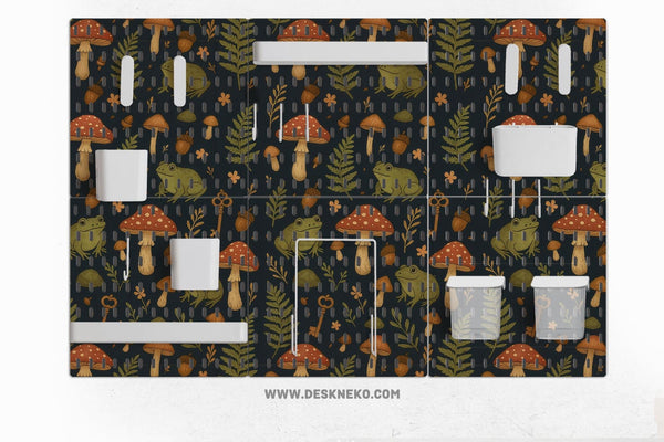 Six pegboard panels with a dark woodland frog and mushroom design, plus hooks, shelves, containers, clips, and a folder holder.