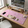 Soft pink desk mat with a kawaii cloud-marble pattern, white crackle lines, and small star accents.