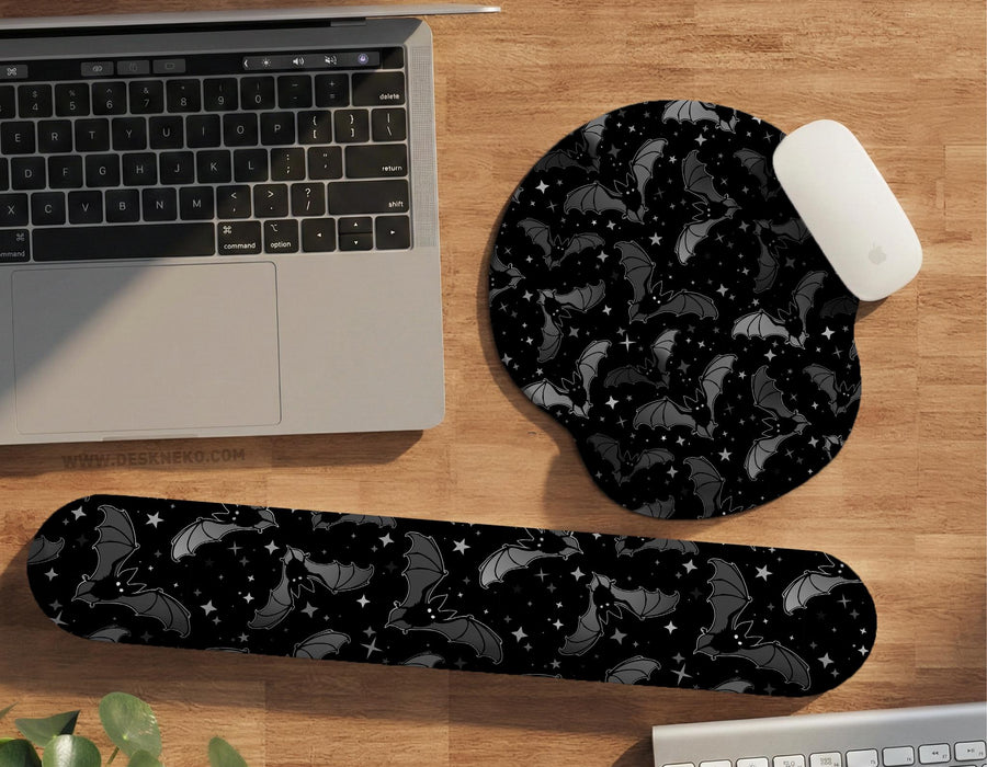 Black mousepad and wrist rest options with a bat and star pattern printed on them.