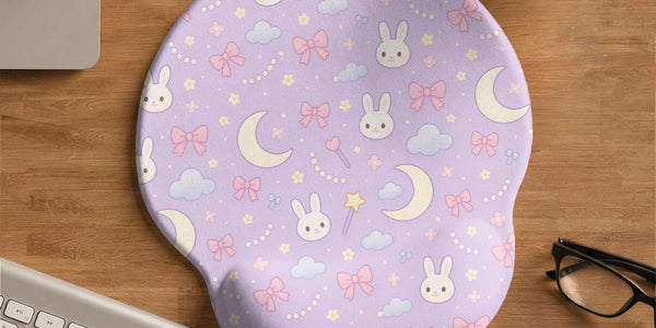 Lavender mouse pad and keyboard wrist rest with bunny faces, clouds, crescent moons, pink bows, and small stars.
