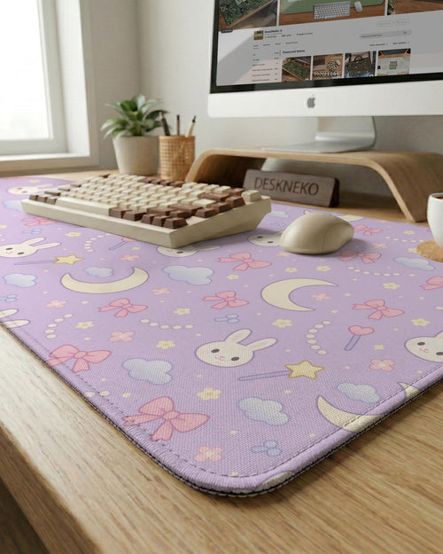 Lavender desk mat with a bunny pattern, moons, stars, clouds, and bows in a pastel style.