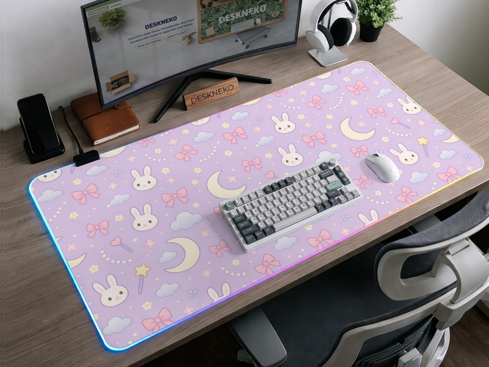Lavender desk mat with a repeating bunny, moon, cloud, and bow pattern in pastel colors.