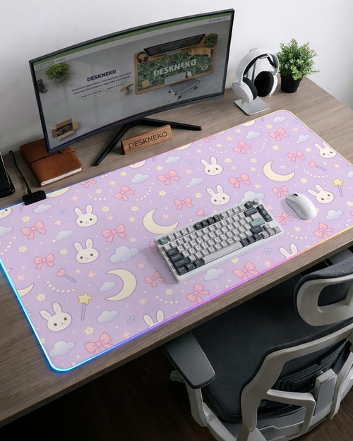 Lavender desk mat with a repeating bunny, moon, cloud, and bow pattern in pastel colors.