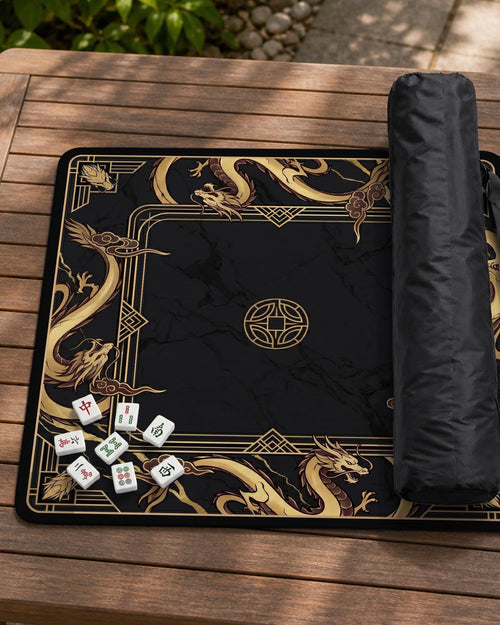 Square black mahjong mat with gold dragon artwork around the border and a light marble texture in the center.
