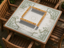 Square mahjong mat with a bamboo garden design, sage green corner panels, an ivory linen-style center, and subtle mist shapes.