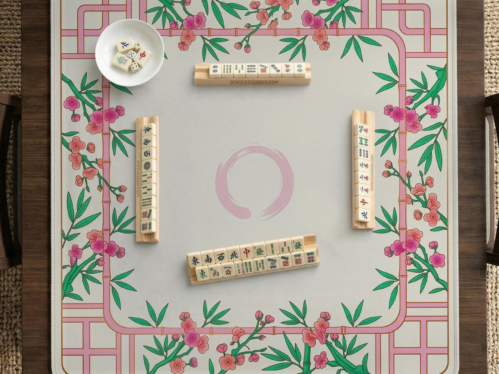 Pink cherry blossom floral mahjong table mat with a cream center and bamboo-style border design.