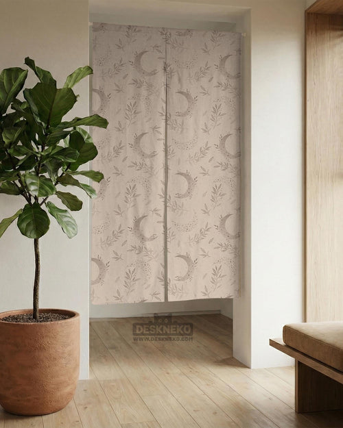 Beige door curtain with a crescent moon, leafy botanical branches, gray line art, and dotted celestial details.