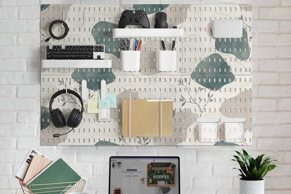 Four square pegboard panels in muted sage green, warm cream, and grey with contour lines and small botanical branch details.