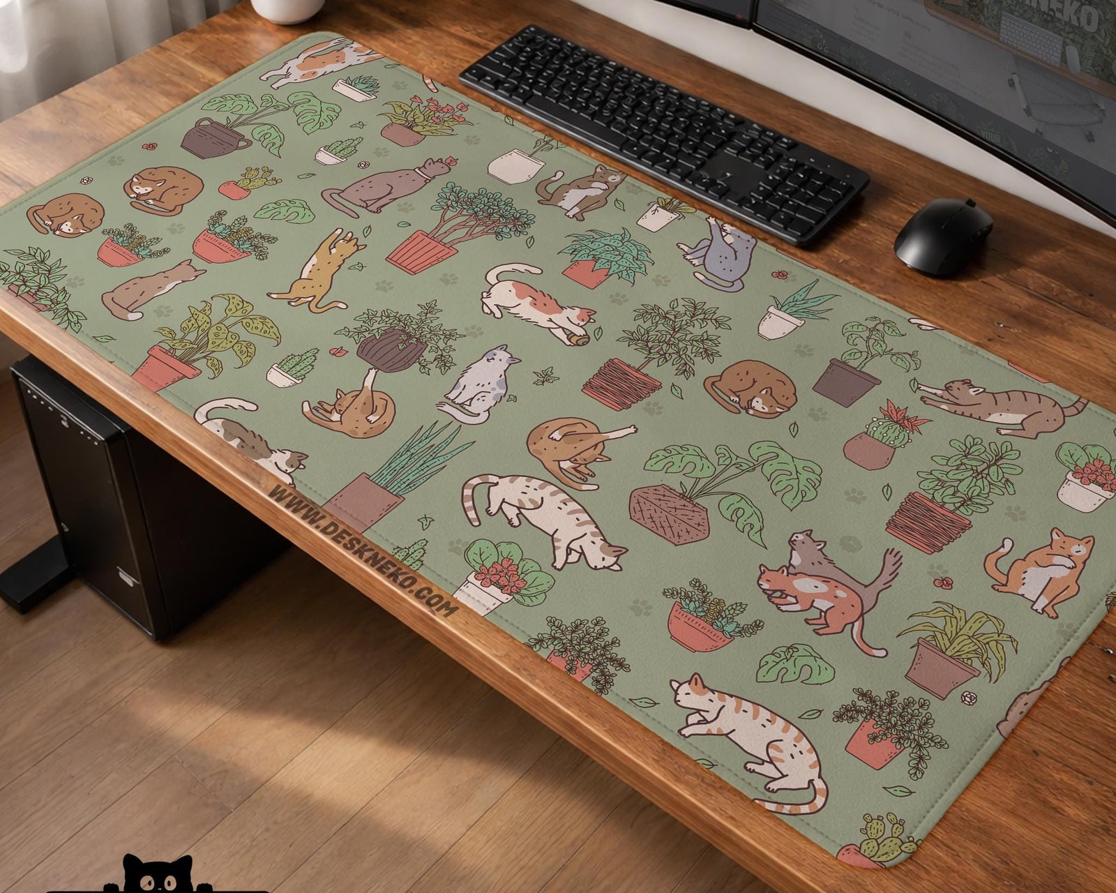 A desk mat with a repeating pattern of cats, leafy houseplants, cactus pots, and small plant-shop style details in sage green.