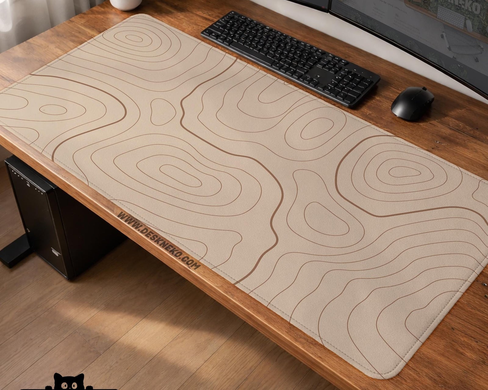Beige desk mat with thin topographic contour lines in a minimal pattern.