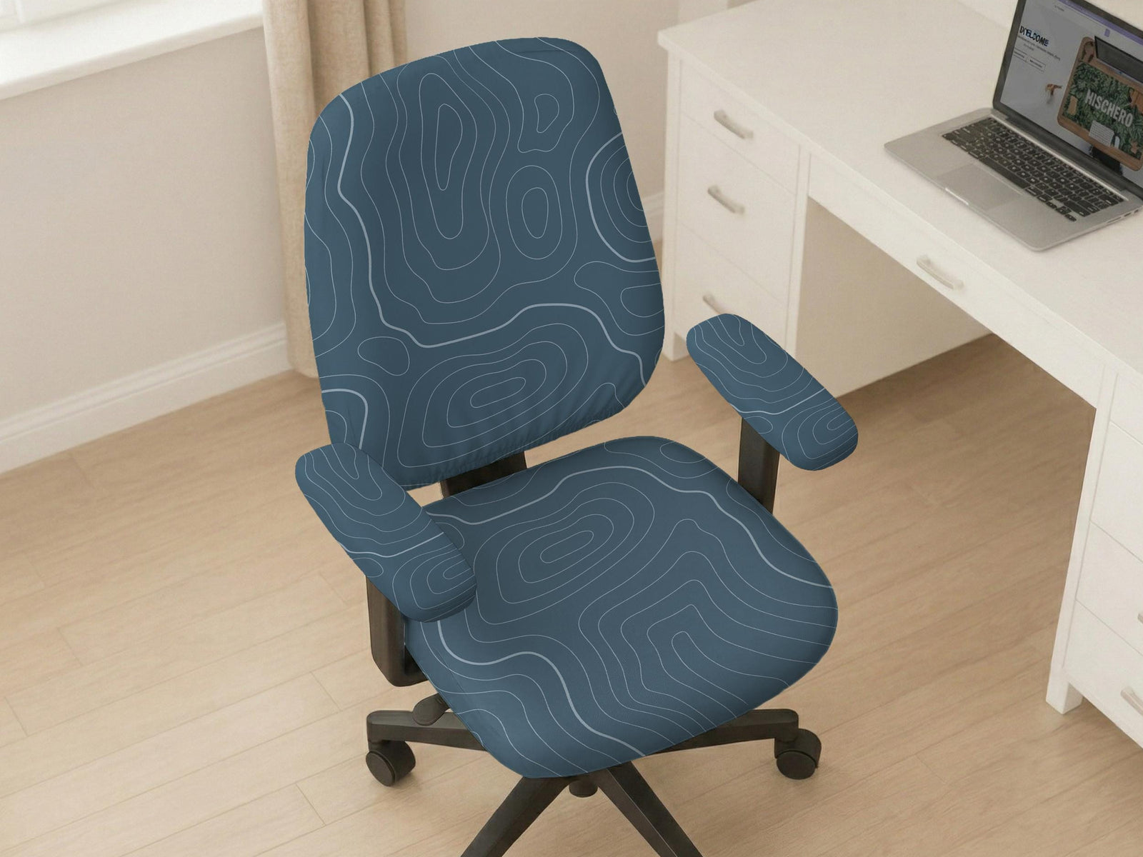 Patina blue desk chair cover with a minimal line art pattern shown on a swivel office chair.