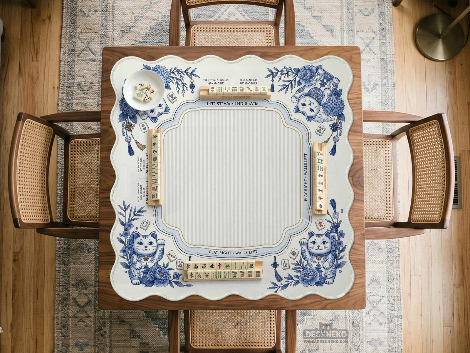 Blue and white square mahjong mat with lucky cat artwork, floral chinoiserie pattern, tile icons, and a rule guide layout.
