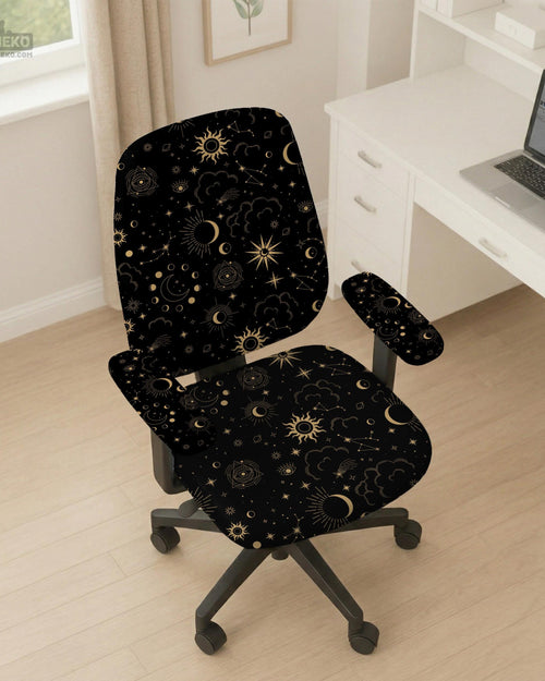 Black chair cover with gold moons, suns, stars, constellations, and line art printed across the fabric.