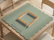 A plain light sage green square mahjong mat with a smooth solid-color surface.
