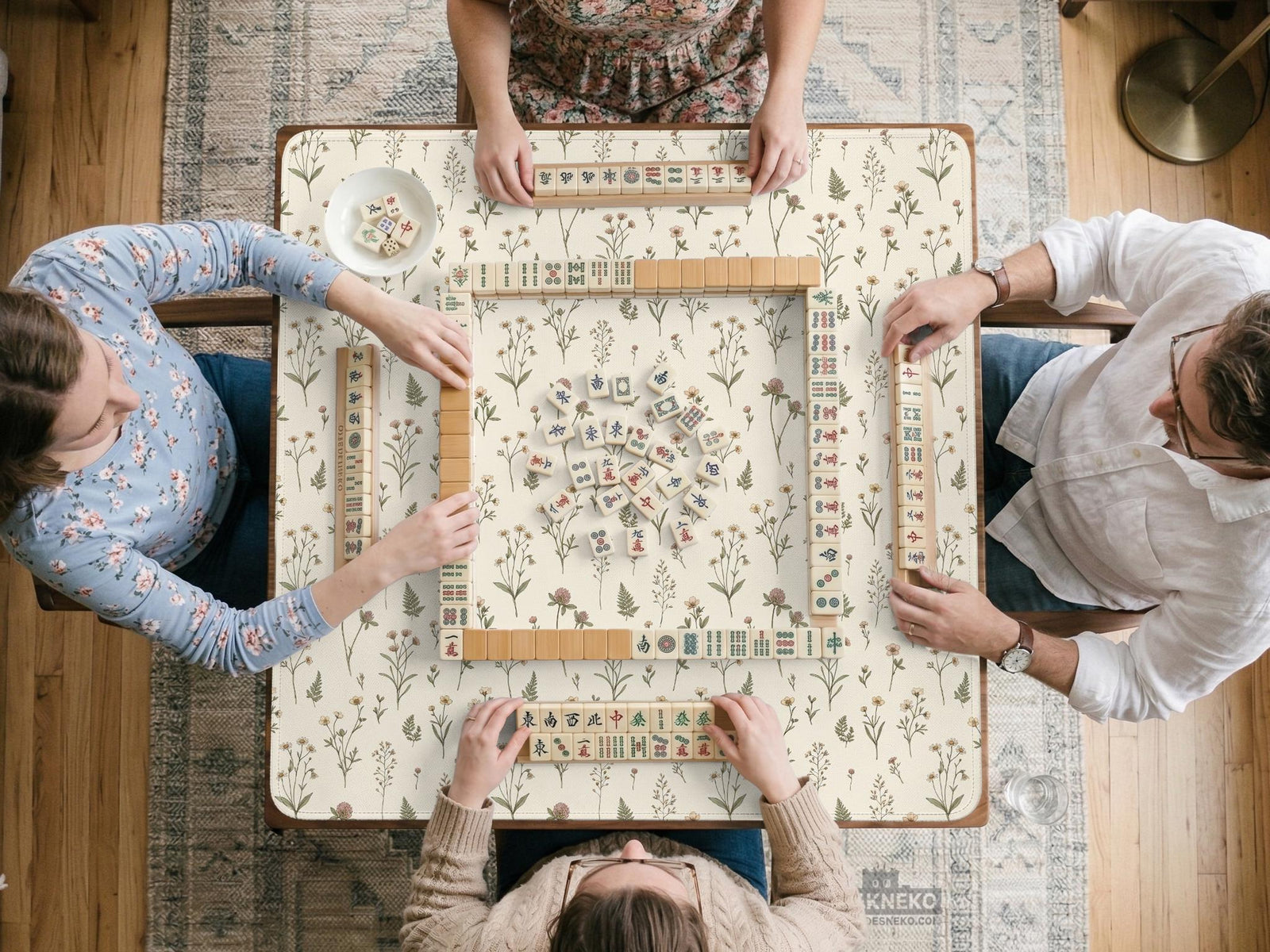 Cream square mahjong mat with a wildflower print, muted green stems, and small cottage-style flowers.