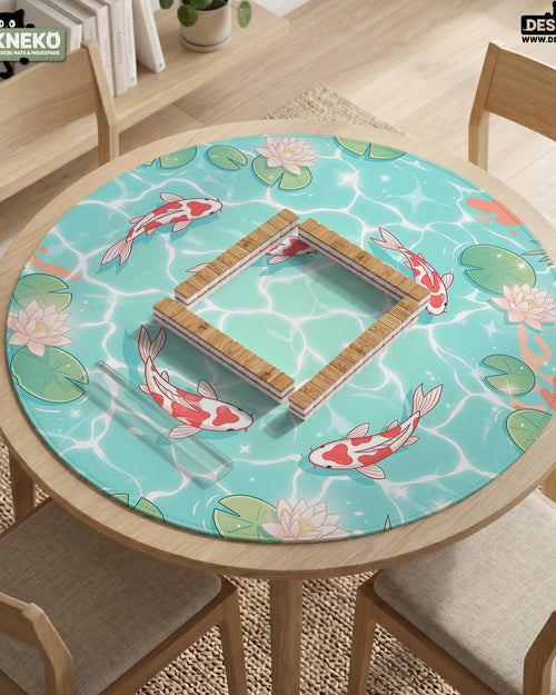 Aqua square mahjong mat with red koi, lotus flowers, lily pads, and tropical leaves on a pond water background with a scalloped edge.