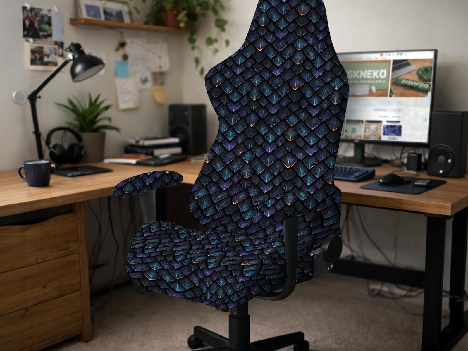 Blue and black chair cover with a dragon scale print in teal, violet, navy, and copper tones.
