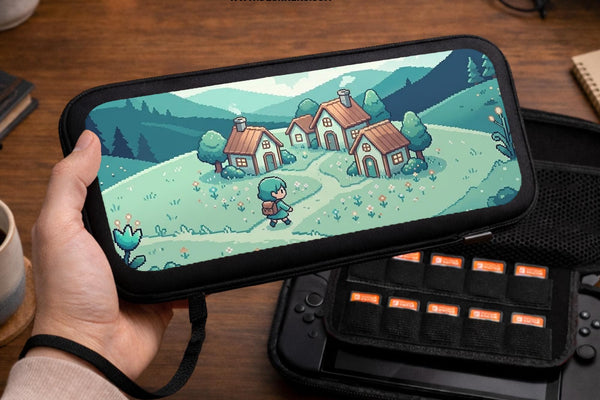 Teal hard shell Switch travel case with pixel art houses, mountains, and a small village scene in green and blue tones.