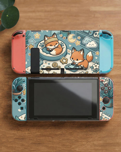 Blue Switch carrying case with cute fox characters, moon and star details, and small potted plants with beige accents.