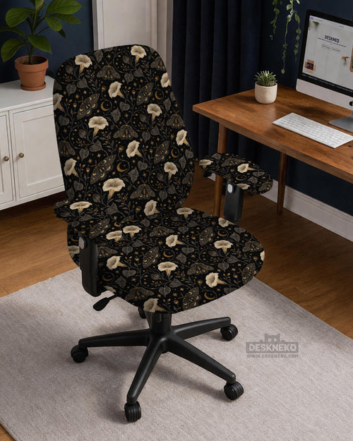 Black chair cover with a moth, moon, and flower pattern in gold, ivory, and dark botanical tones.