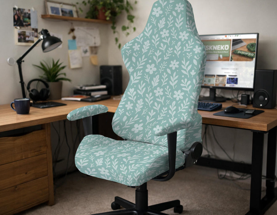 Sage and aqua green floral chair cover shown on a gaming chair with matching armrest covers.