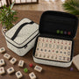 Green Mahjong tile carrier bag with a sage leaf botanical pattern, zipper closure, and top handle.