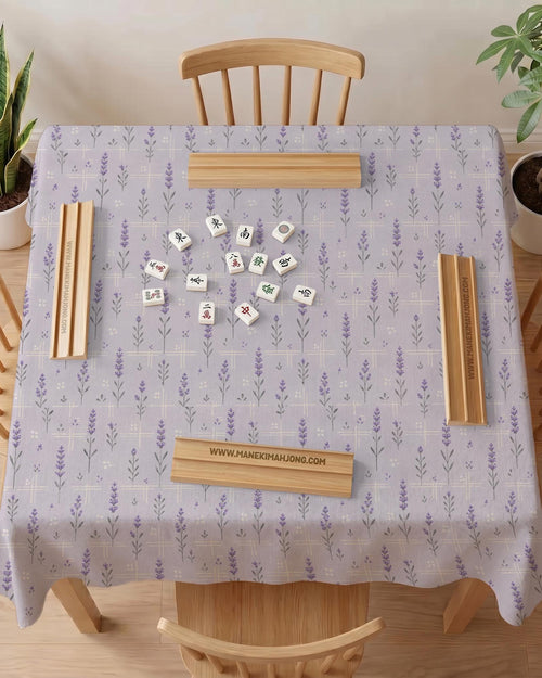 Lavender mahjong mat with a pale purple background, small botanical sprigs, and fine grid lines.