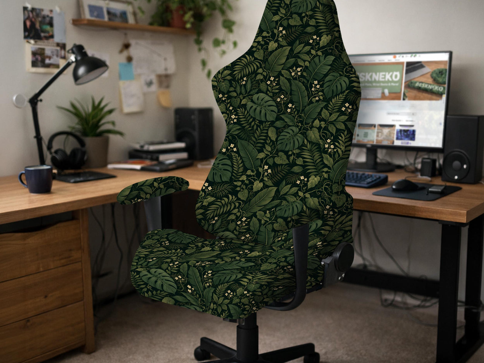Black and green tropical leaf print chair cover shown on a high back swivel chair with armrests.