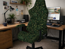 Black and green tropical leaf print chair cover shown on a high back swivel chair with armrests.