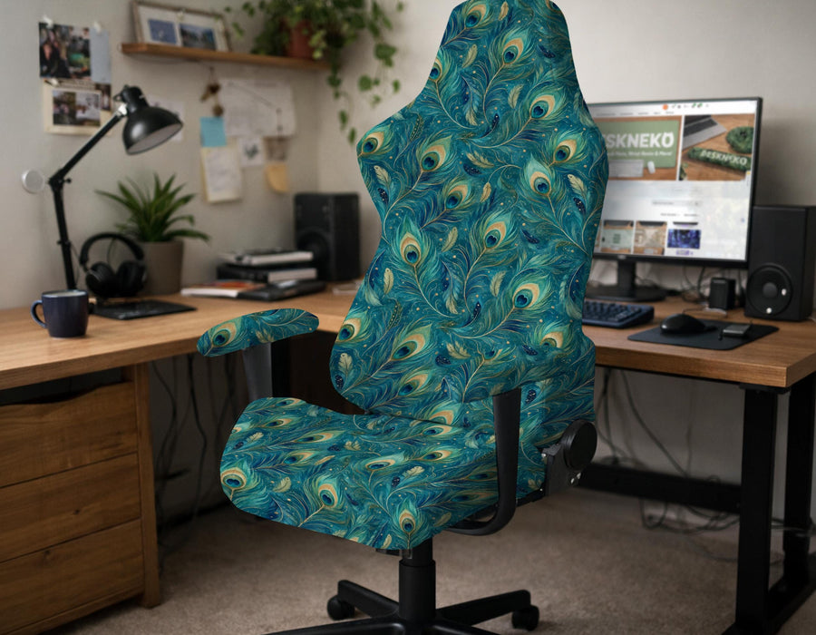 A blue green chair cover with a peacock feather design shown on an office chair with armrests.