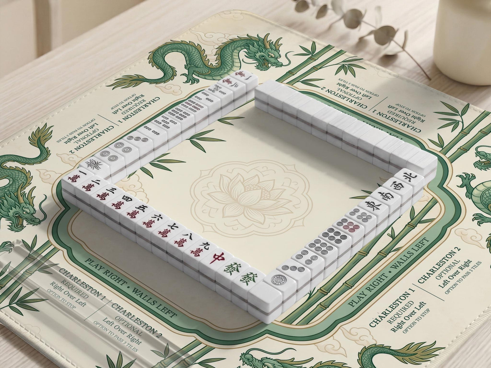 Cream mahjong mat with a green dragon design, bamboo details, and rule prompts along the border.