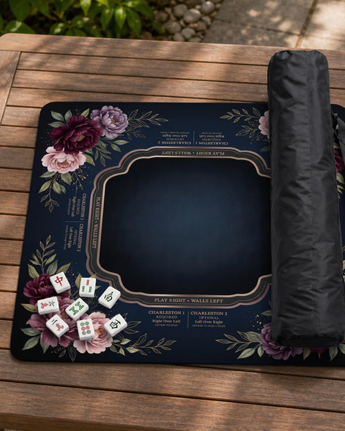 A square mahjong mat with peony flowers and printed American mahjong instructions around the edges.